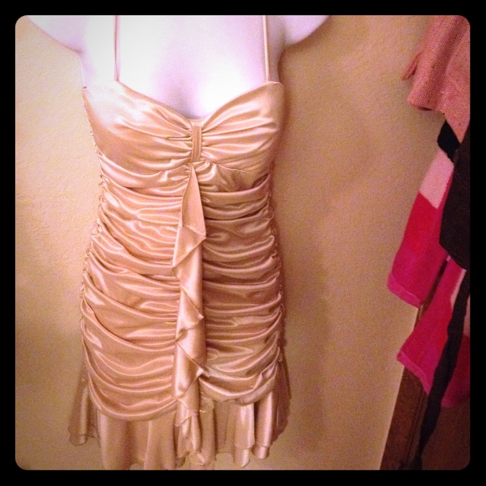 Spaghetti strap gold mini dress.